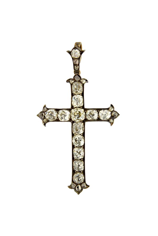 A Victorian diamond set pendant cross, mounted with rows of cushion shaped diamonds and with rows of three rose cut diamonds to the terminals of the a