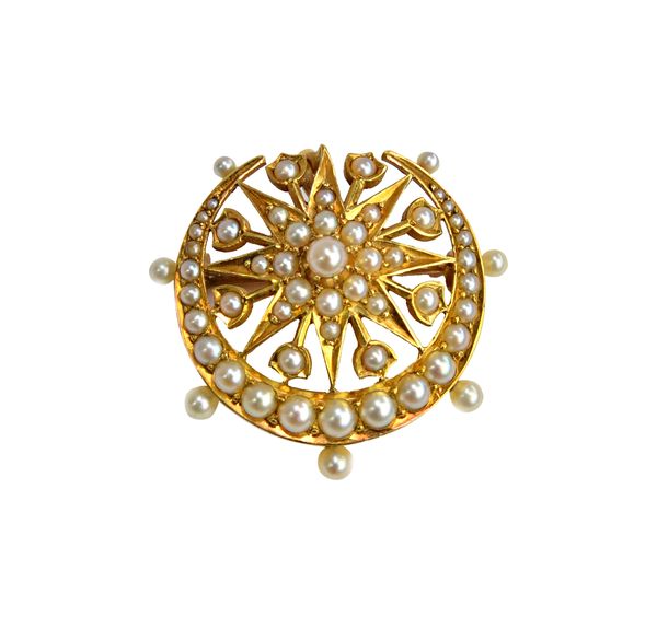 A gold and seed pearl set brooch, in a starburst and crescent shaped design, circa 1900, gross weight 8 gms.   Illustrated