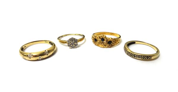 A 9ct gold and diamond set seven stone cluster ring, two 9ct gold and diamond set rings and a gold and sapphire set ring, designed as three flowerhead