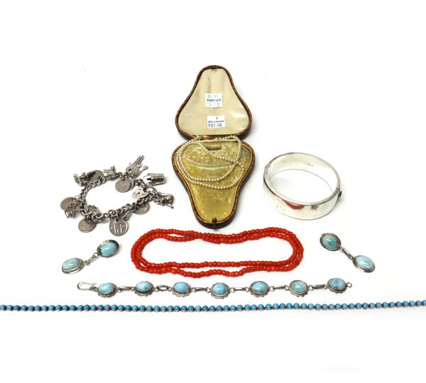 A single row necklace of coral beads, a single row necklace of imitation pearls, with a case, a silver oval hinged bangle, with engraved decoration, o