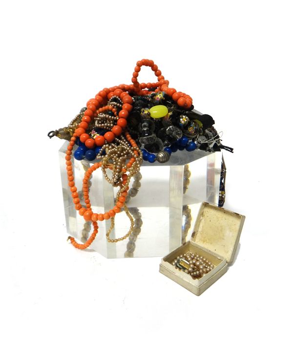 A single row necklace of graduated coral beads, a single row necklace of glass imitating coral beads, three vary coloured glass bead necklaces, probab