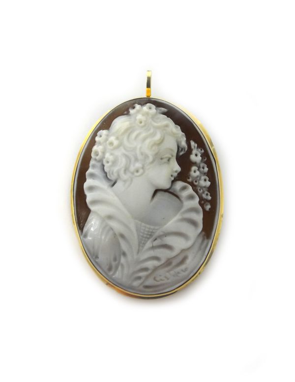 A gold mounted oval shell cameo pendant brooch, carved as the portrait of a lady, detailed 750.