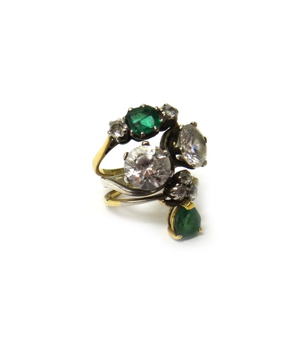 Two gold rings and one other ring, mounted with two larger colourless gems, five smaller cushion shaped diamonds and with two emeralds, as made into o