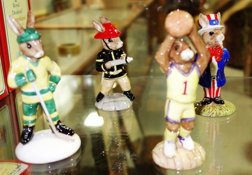 Four Royal Doulton Bunnykins figures; DB50 Uncle Sam 1999, DB262 Basketball 2002, limited edition of 2000, DB268 Firefighter 2002, limited edition of