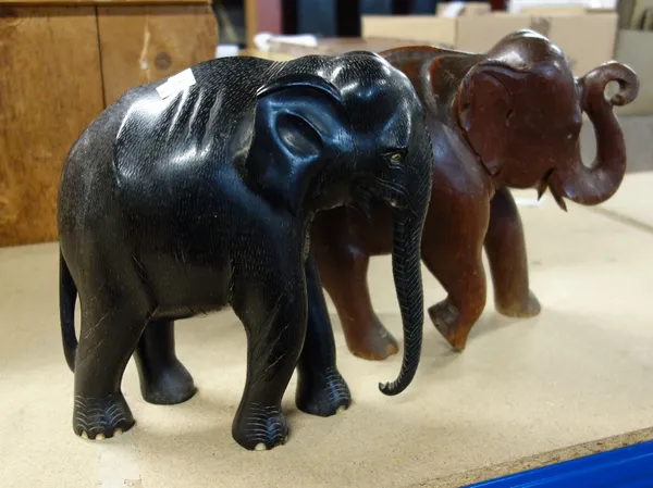 A quantity of assorted African souvenir carved elephants including a pair of ebony bookends, (qty).  SH5