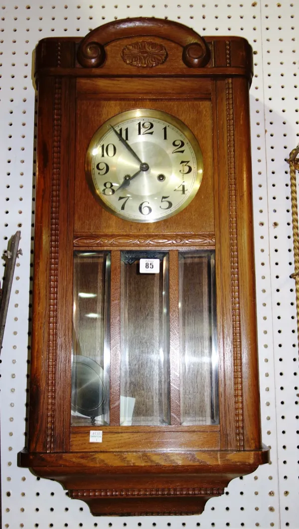A 20th century walnut cased eight day wall clock.  CAB
