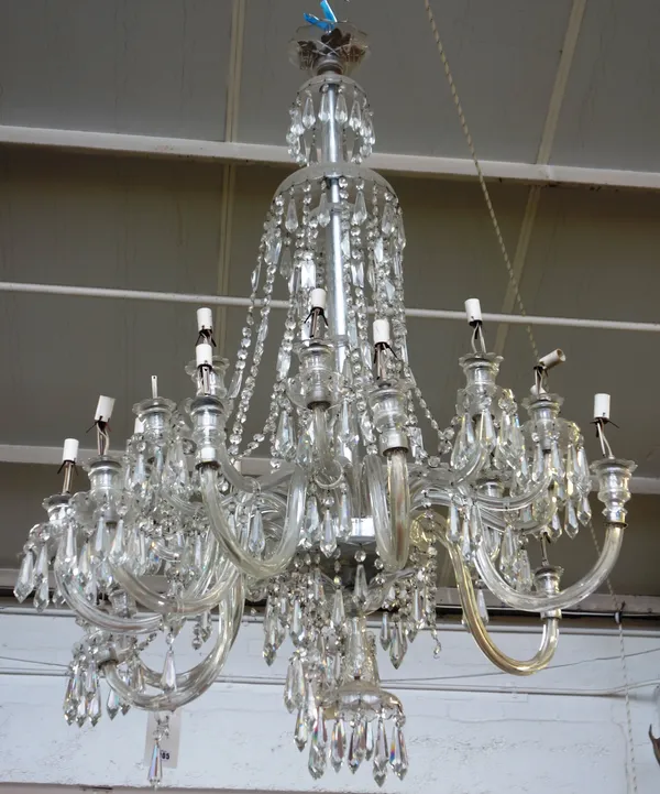 A twenty four light cut glass and moulded chandelier, early 20th century, the central glass suspension rod with five glass domed embellishments at var