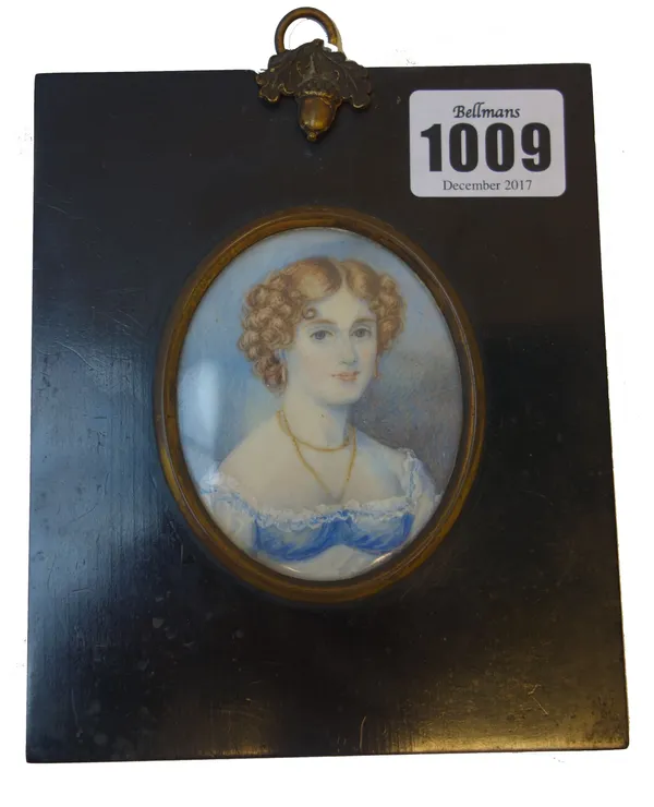 A mid-19th century English School portrait miniature on ivory of 'Miss Danby', her hair in ringlets, with gold necklace and white lace trimmed dress,