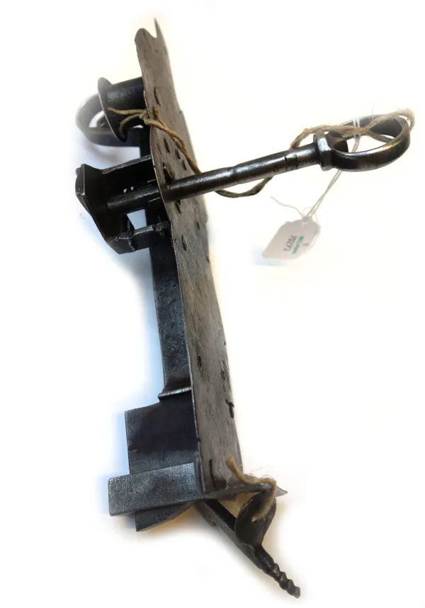 A 17th century Continental steel door lockplate and key, with working mechanism, 26cm.