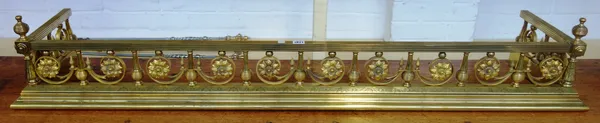 A Victorian gilt brass fire fender, with pierced foliate rail over an engraved stepped plinth, 157cm wide.