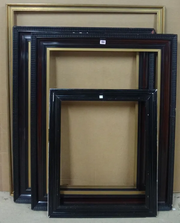 A group of four 20th century frames, including a near pair of ebonised frames with gilt slip, and two others, (4).  CAB