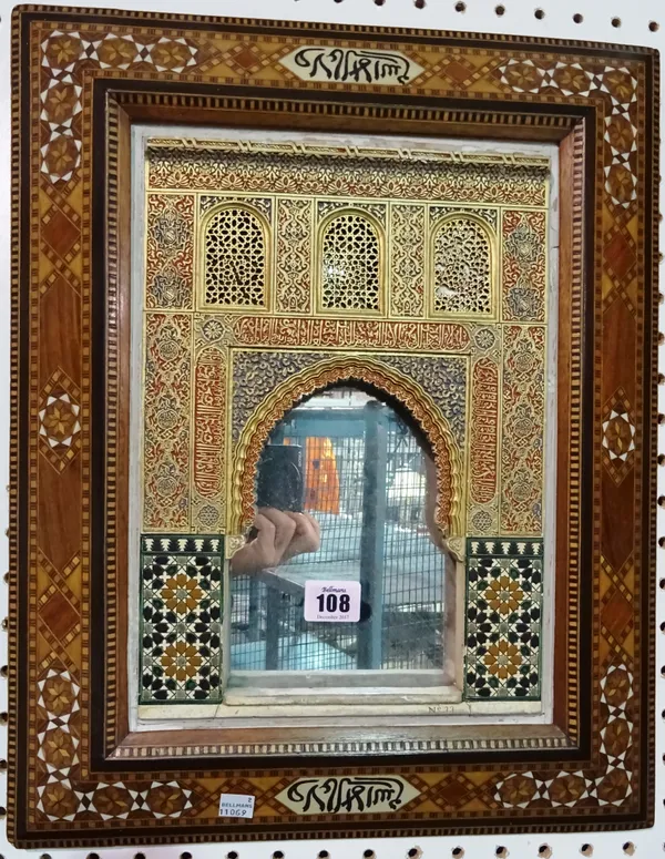 An Eastern inlaid wall mirror in the form of a doorway.  CAB