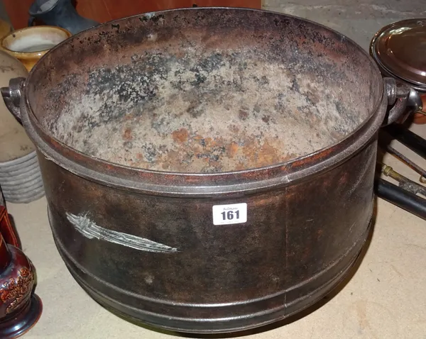 A 19th century steel cauldron, with swing over handle. S2