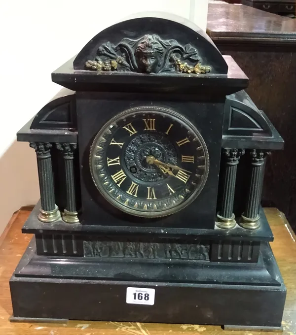 A 19th century black slate cased mantel clock.  I5
