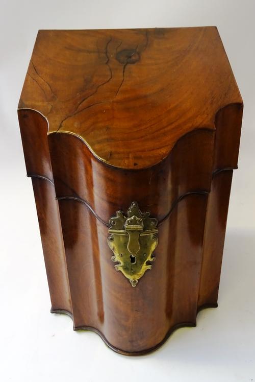 A George III mahogany slope top knife box, with serpentine front, 23cm wide x 35cm high x 26cm deep.