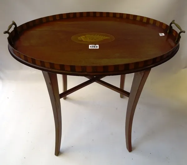An Edwardian inlaid mahogany oval tray, on four splayed supports, 57cm wide x 54cm high x 38cm deep.