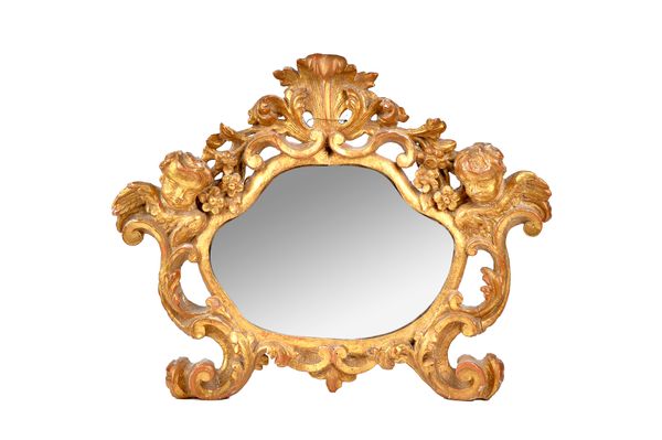 A 19th century Italian gilt framed mirror, with shell crest and winged cherub mounts, 58cm wide x 45cm high.  Illustrated