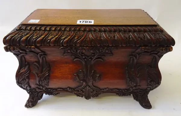 A Rococo Revival carved mahogany bombe shaped casket, with lift-off rectangular top, 30cm wide x 21cm high x 17cm deep.