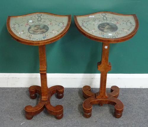 A pair of early 19th century yew wood framed pole screens, with shield shaped panels on opposing 'C' shaped bases, later converted to tables, each 44c