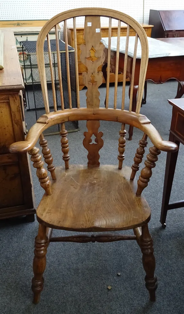 A pair of Victorian style ash and elm Windsor chairs, with solid seats and turned supports, 66cm wide x 118cm high.