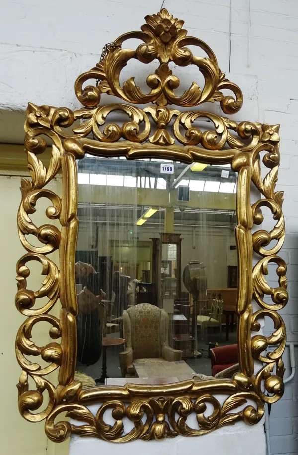 A 19th century gilt framed wall mirror with pierced acanthus frame about the rectangular mirror plate, 62cm wide x 102cm high.