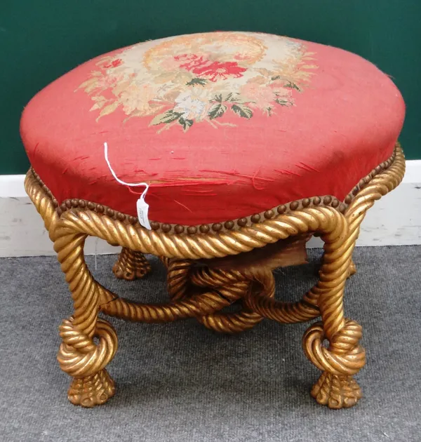 A Napoleon III footstool, with gilt ropetwist base, 55cm wide x 39cm high.