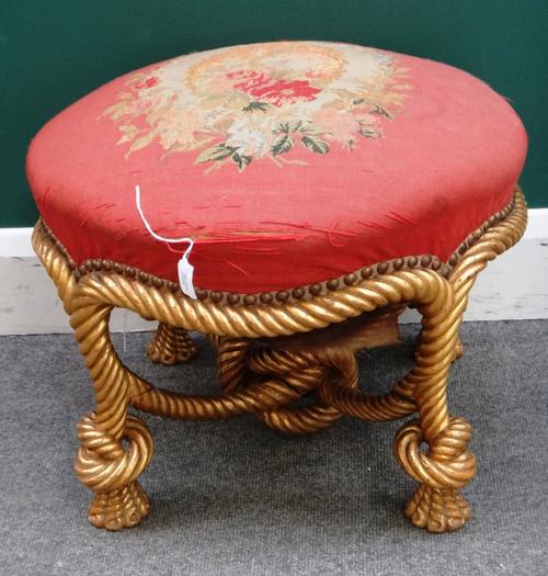 A Napoleon III footstool, with gilt ropetwist base, 55cm wide x 39cm high.