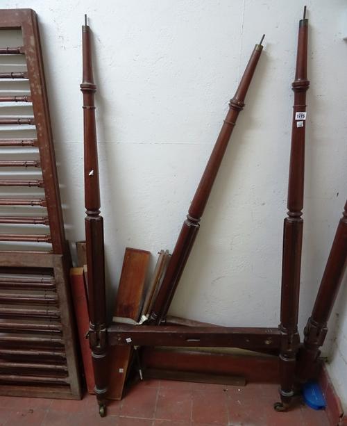 A 19th century child's/dog's mahogany four poster bed, with arch canopy and turned supports, 159cm wide  82cm deep x 175cm high.