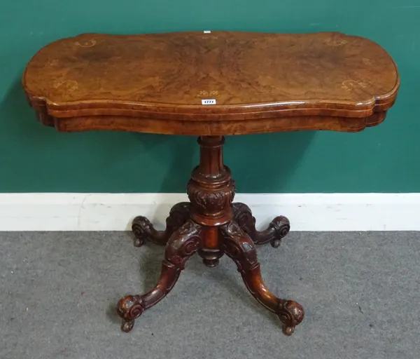 A Victorian marquetry inlaid figured walnut card table, the shaped foldover top on carved column and four downswept supports, 95cm wide x 75cm high x