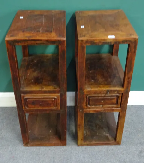 A pair of Chinese stained elm rectangular three tier side tables, with single drawer, on block supports, 32cm wide x 87cm high x 47cm deep.
