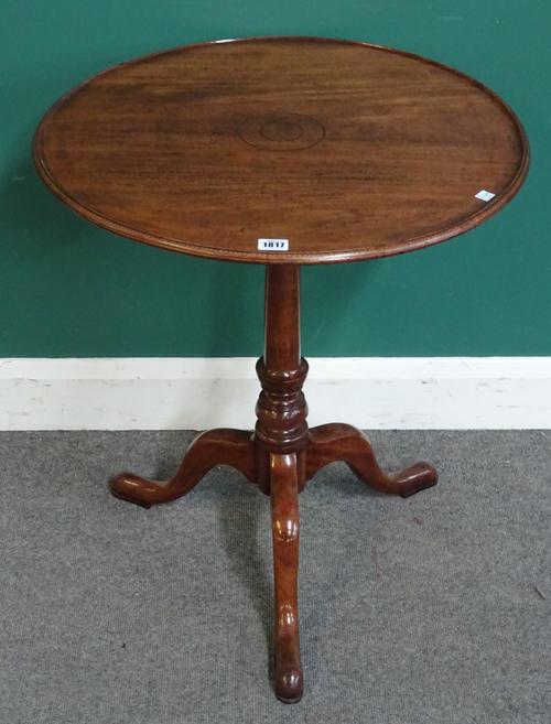 A George III mahogany occasional table, the dished circular snap top on tripod base, 60cm wide x 71cm high.