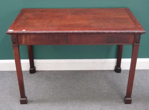 A George III mahogany side table, the rectangular top on four chamfered square supports, 113cm wide x 78cm high x 60cm deep.