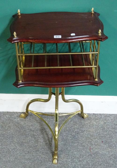 A late 19th century French mahogany and brass two tier magazine stand, on tripod base, 46cm wide x 75cm high x 33cm deep.