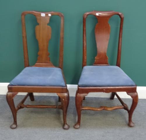A  set of eight mid-18th century mahogany vase back dining chairs, on club supports, united by shaped stretcher, (8).