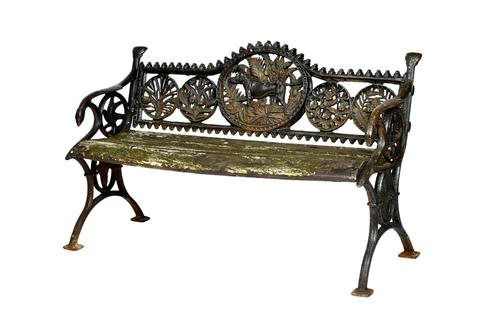 A suite of early 20th century garden furniture, comprising; a bench 127cm wide x 75cm high and a pair of armchairs, 70cm wide x 75cm high, each relief