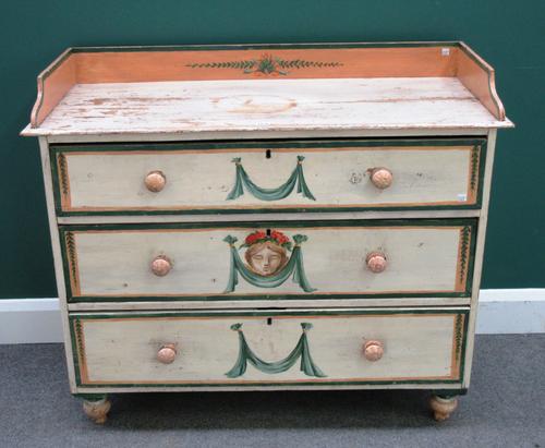 A 19th century Continental later painted pine chest of three long drawers, on turned feet, 107cm wide x 89cm high x 45cm deep.