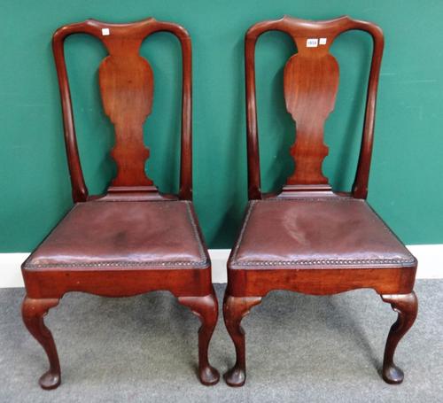 A pair of George II mahogany side chairs with vase back and straight front seat on pad feet, 58cm wide x 102cm high.