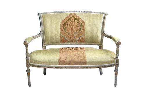 A Louis XVI style green painted open arm sofa, with bow seat on tapering turned supports, 123cm wide x 93cm high. Illustrated