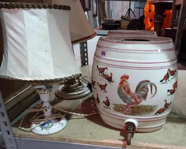 A pair of China barrels, with taps, decorated with cock fighting scenes and two ceramic lamps, (4). S2