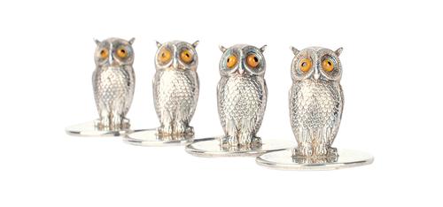 A set of four silver menu stands, each designed as a standing owl, having boot button eyes, by Goldsmiths & Silversmiths Company, Chester 1911, with t