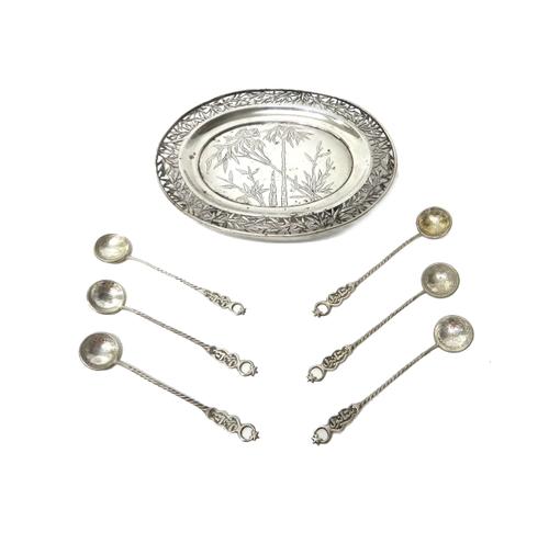 A Chinese circular dish, engraved with bamboo to the centre, within a pierced foliate border, raised on four feet, length 16cm and a set of six Turkis