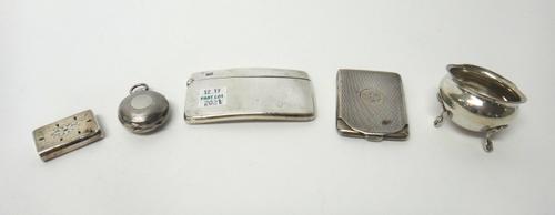 Silver, comprising; a sovereign case, with engine turned decoration, Birmingham 1905, a curved rectangular visiting card case, Chester 1908, a hinge l