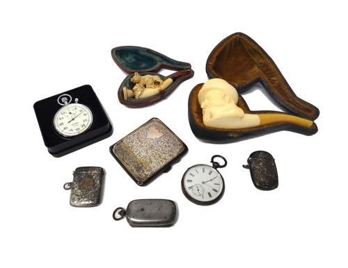 Silver, comprising; two rectangular vesta cases, with engraved decoration, Chester, 1899 and 1920, a rectangular cigarette case, Birmingham 1925, a ba