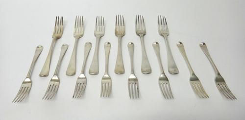 Silver Old English pattern table flatware, comprising; six dessert forks, London 1818, two dessert forks, London 1815, one table fork, London 1806 and