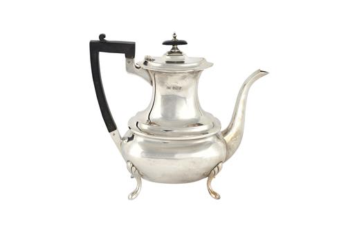 A silver five piece tea and coffee set, comprising; a teapot, a coffee pot, a hot water jug, a twin handled sugar bowl and a milk jug, each piece with