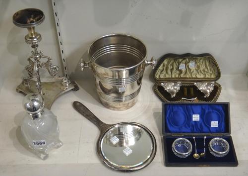 A Victorian large silver topped glass oval scent bottle, with spiral decoration, raised on four feet, London 1892, a pair of silver rimmed, faceted gl