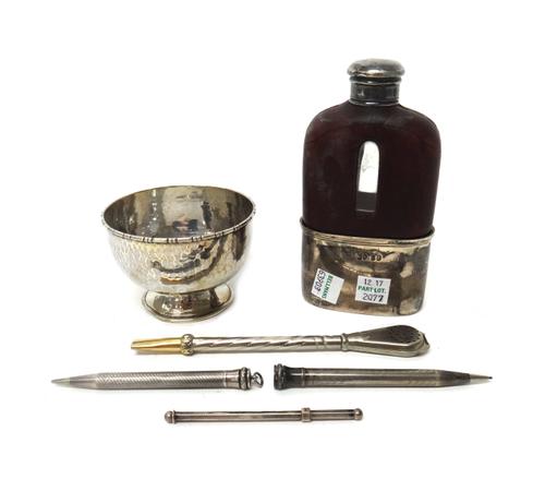 A George IV silver mounted partly leather covered glass spirit flask, with a pull-off beaker base, London 1828, a silver bowl, with martele decoration