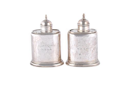 A George II silver tea caddy, of oval form, with a detachable slide action cover and lid, later crest engraved, London 1731 and another silver tea cad