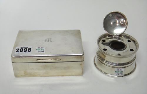 Silver, comprising; a rectangular table cigarette box, wooden lined within, London 1946 and a Victorian circular pen and ink stand, the hinged lid wit