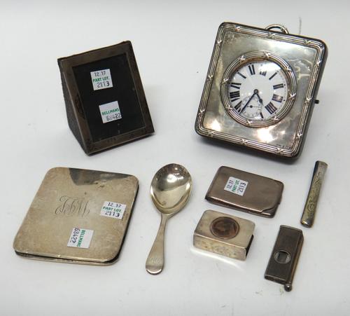 A base metal cased keyless wind open faced Goliath watch, the enamelled dial with black Roman numerals, with a silver fronted square travelling case,